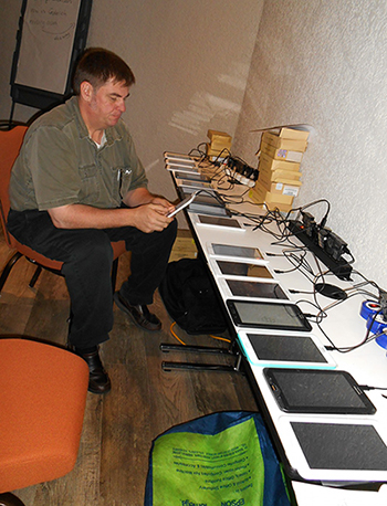 Ray Ransom with tablets procured with CDC Foundation funds for nationally representative survey of knowledge, attitudes, and practices with regards to Ebola.